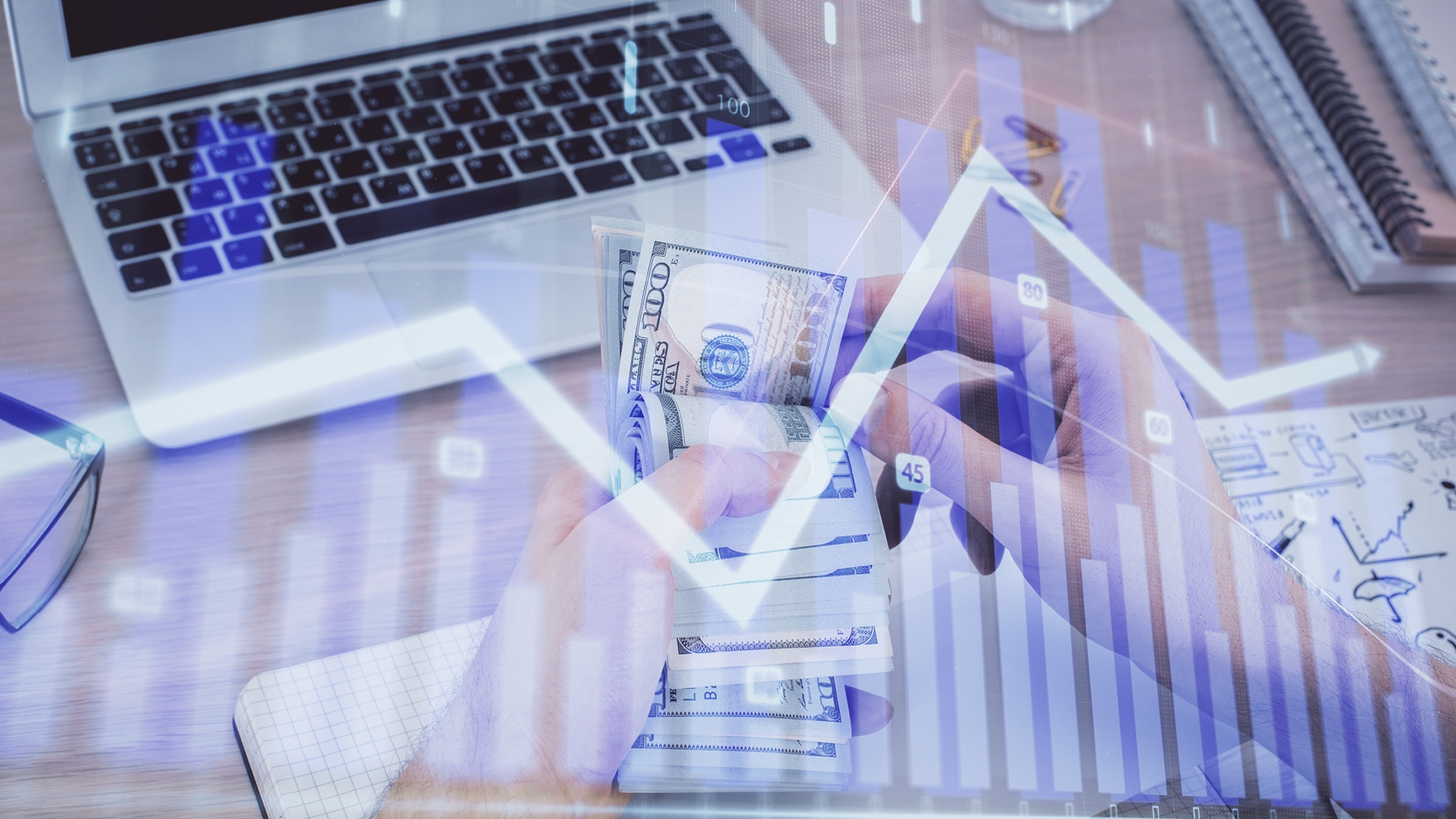 158025768-multi-exposure-of-financial-graph-drawing-hologram-and-usa-dollars-bills-and-man-hands-analysis.jpg